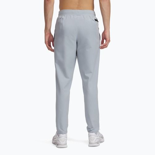 Pánské tréninkové kalhoty Under Armour Unstoppable Tapered harbor blue/black