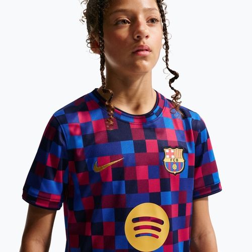 Dětské fotbalové tričko Nike FC Barcelona Dri-Fit Pre-Match noble red/mineral yellow