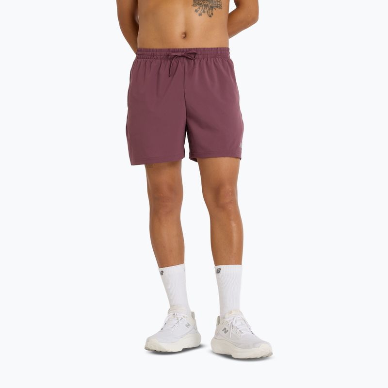 Pánské běžecké šortky New Balance Sport Essential 5" fadedplu
