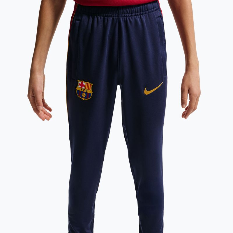 Dětské fotbalové kalhoty Nike FC Barcelona Strike Dri-Fit blackened blue/noble red/yellow 7