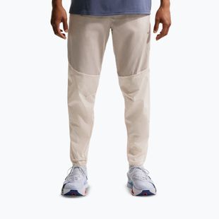 Pánské běžecké kalhoty Nike Stride Repel Woven cream li/birch/natural